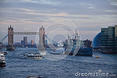 The bridge crosses theÂ River ThamesÂ close to the Tower of LondonÂ and has become an iconic symbol of London Editorial Stock Photo